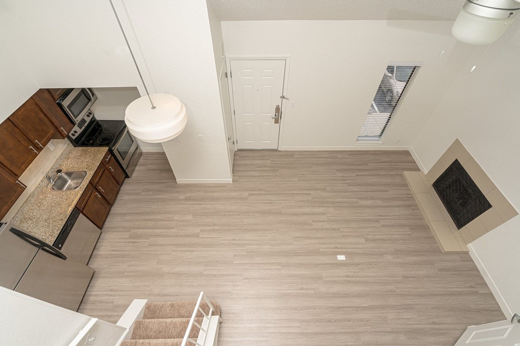 a view of the kitchen and living room from the loft